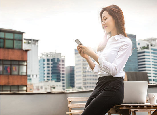 Businesswoman looking at mobile phone
